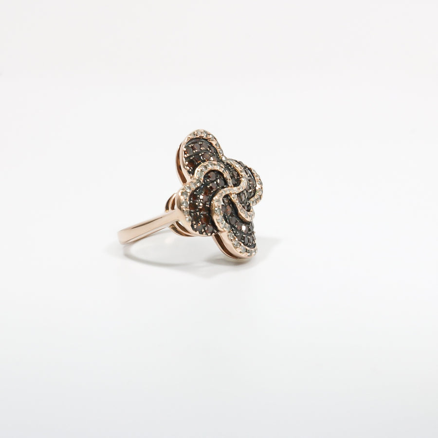 ROSE GOLD LADY'S SWIRL RING WITH BROWN AND WHITE DIAMONDS.