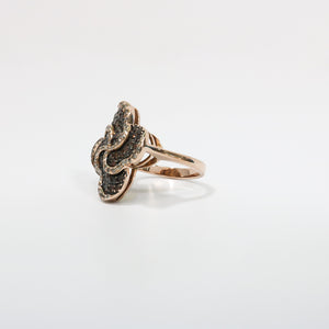 ROSE GOLD LADY'S SWIRL RING WITH BROWN AND WHITE DIAMONDS.