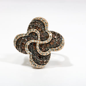 ROSE GOLD LADY'S SWIRL RING WITH BROWN AND WHITE DIAMONDS.