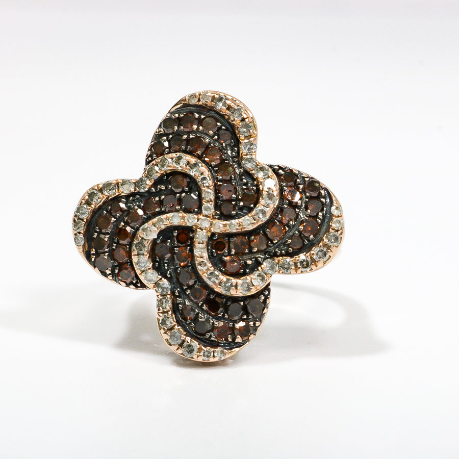 ROSE GOLD LADY'S SWIRL RING WITH BROWN AND WHITE DIAMONDS.