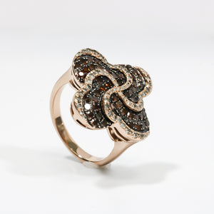 ROSE GOLD LADY'S SWIRL RING WITH BROWN AND WHITE DIAMONDS.