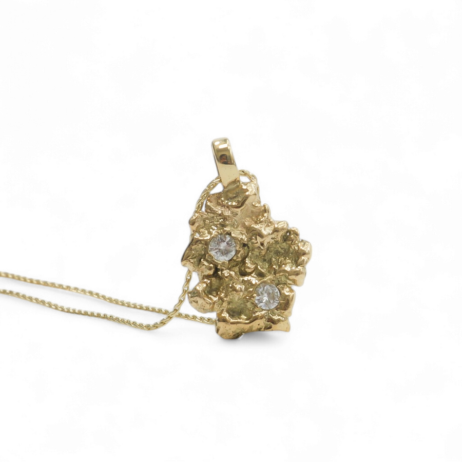 YELLOW GOLD NUGGET PENDANT WITH NATURAL DIAMONDS.