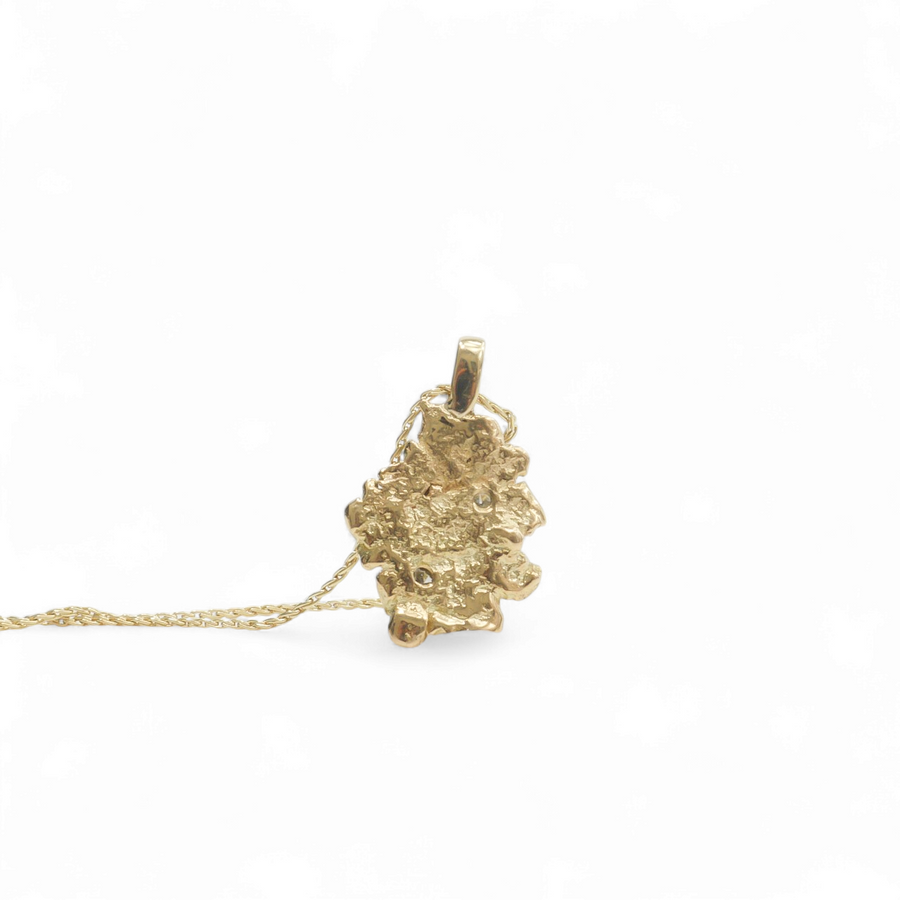 YELLOW GOLD NUGGET PENDANT WITH NATURAL DIAMONDS.