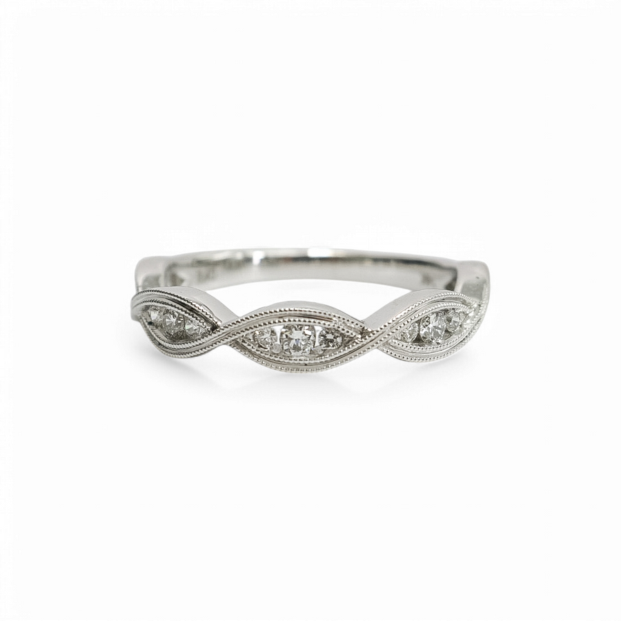 WHITE GOLD INFINITY BAND WITH NATURAL DIAMONDS.