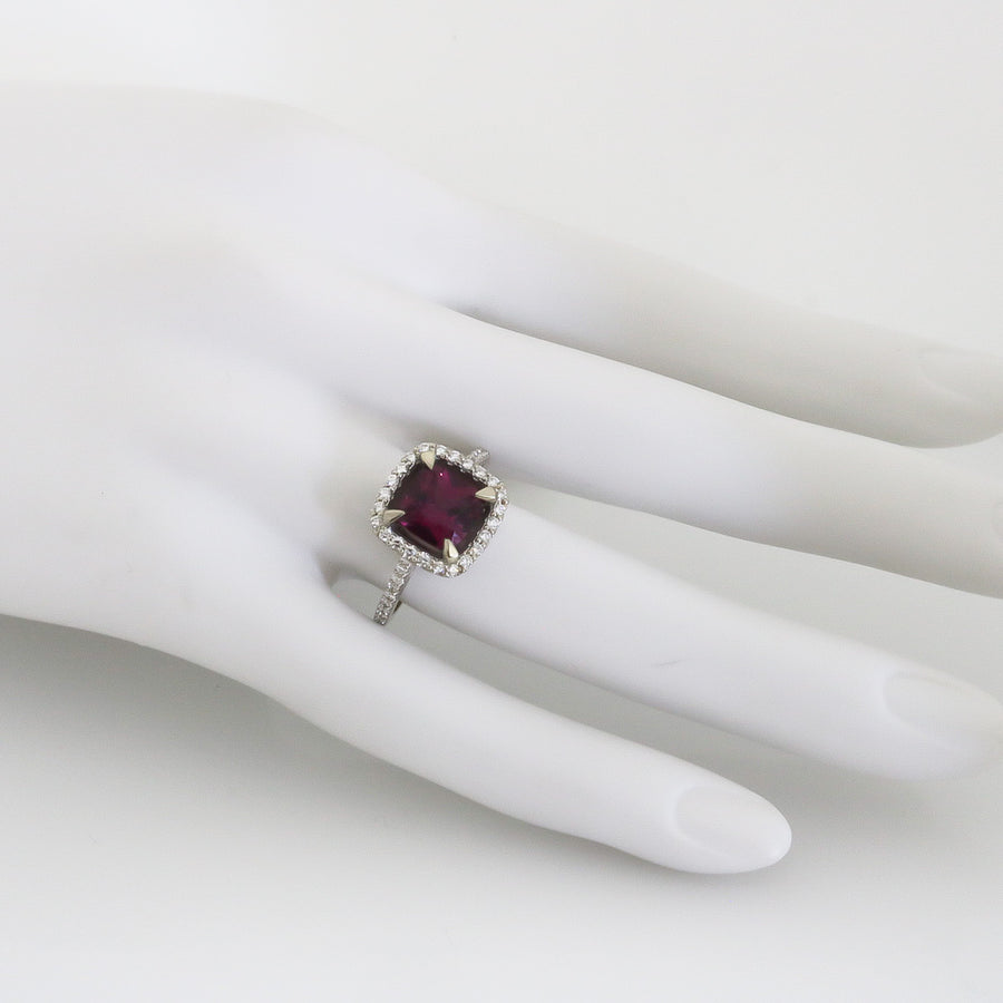 DARK PINK STONE SET ON A HALO SETTING