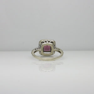 DARK PINK STONE SET ON A HALO SETTING